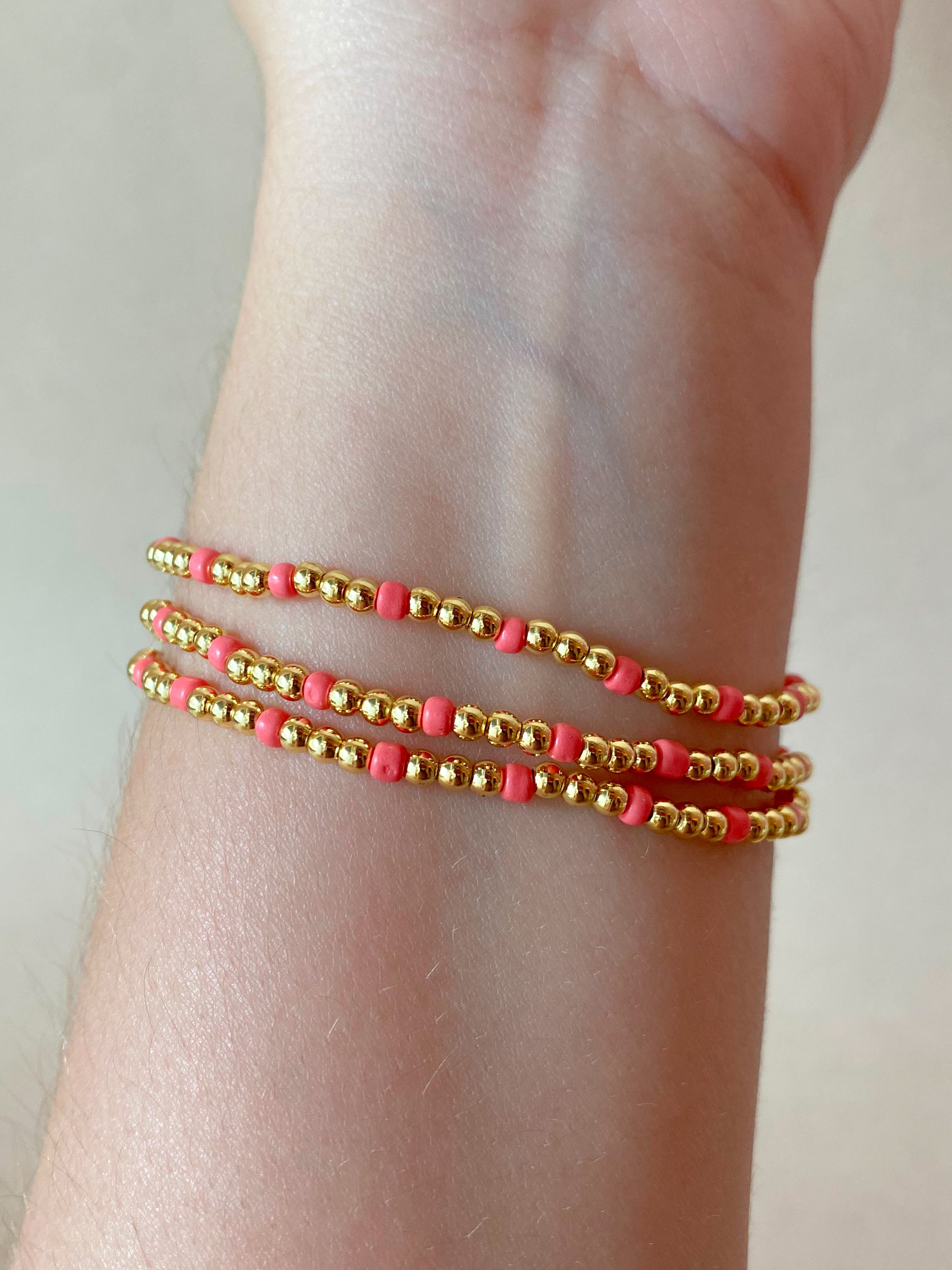 Set of 3 Elastic Golden and Pink Beads Bracelets