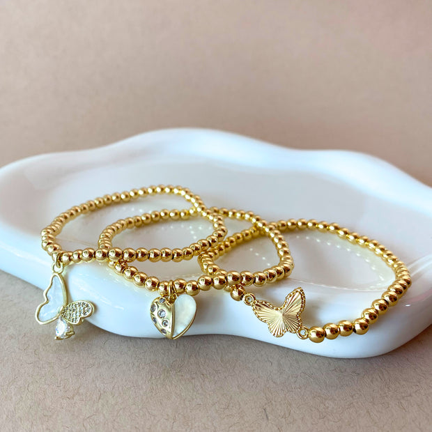 2 Styles of Butterfly Charms and Heart Charm in Golden Elastic Bracelet