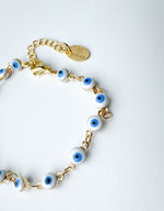Load image into Gallery viewer, Brazalete Ojitos Blancos Protección
