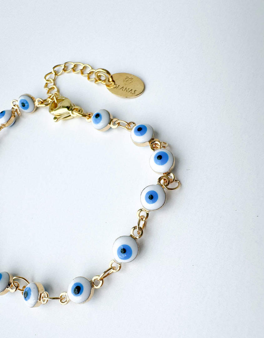 Brazalete Ojitos Blancos Protección