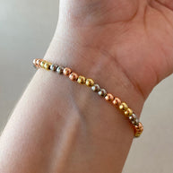 3 Gold Elastic Our Father Bracelet