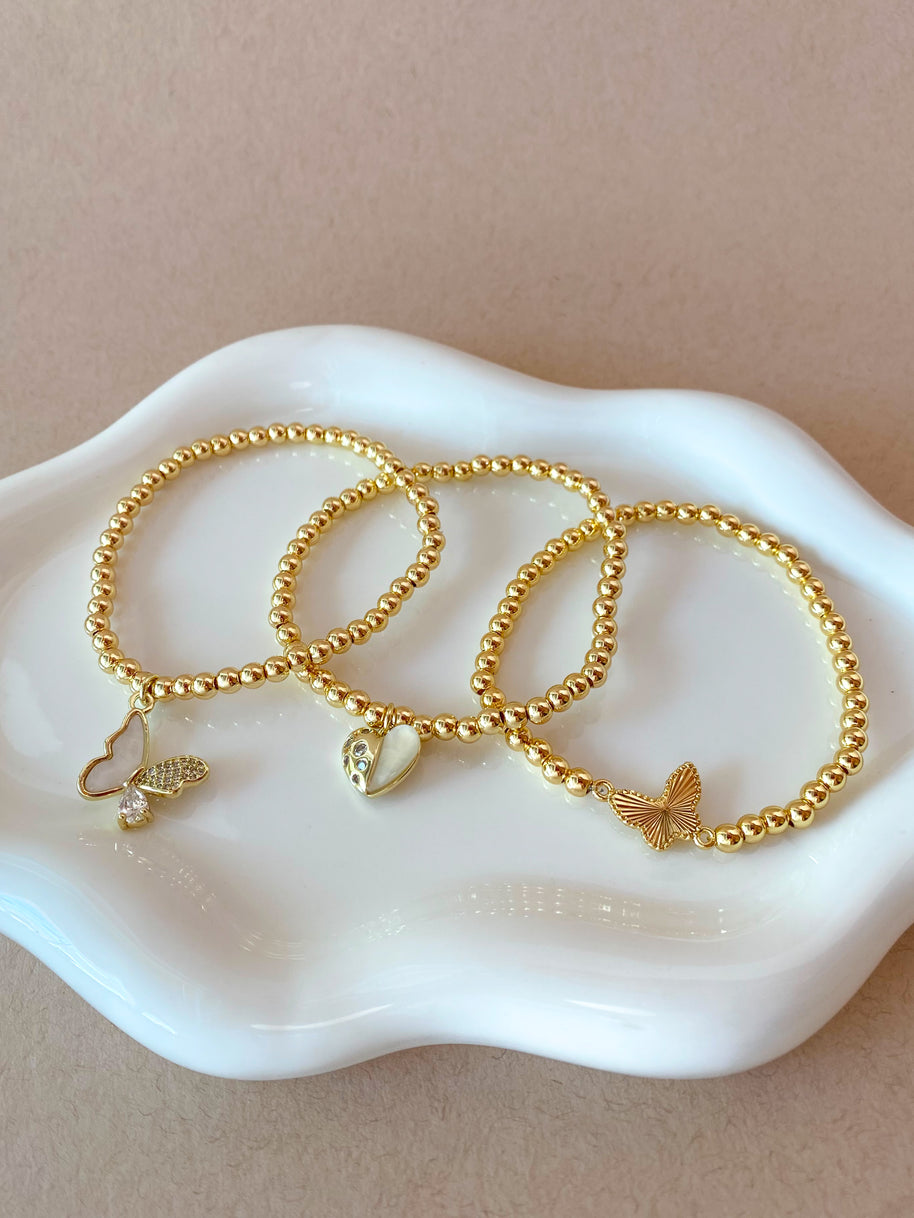 2 Styles of Butterfly Charms and Heart Charm in Golden Elastic Bracelet