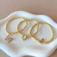 2 Styles of Butterfly Charms and Heart Charm in Golden Elastic Bracelet