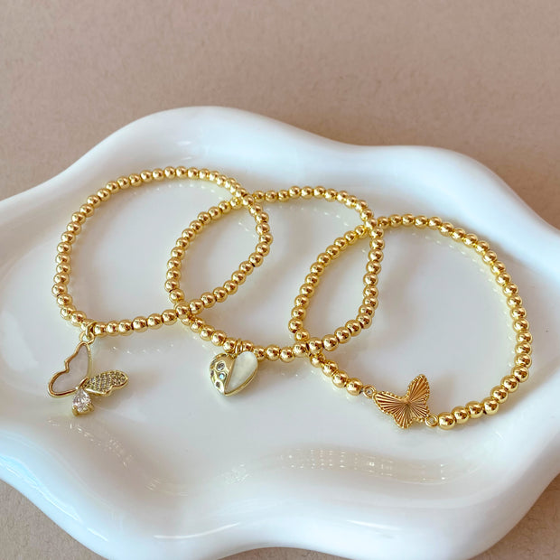 2 Styles of Butterfly Charms and Heart Charm in Golden Elastic Bracelet