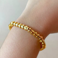 Golden Cylinder Beads Style Elastic Bracelet