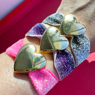 Brazaletes Elásticos Rosa, Morado y Gris + Corazones Gold