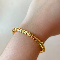 Golden Cylinder Beads Style Elastic Bracelet