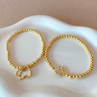Mother of pearl and Crystal Dogs Charms Golden Elastic Bracelet