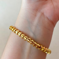 Golden Cylinder Beads Style Elastic Bracelet