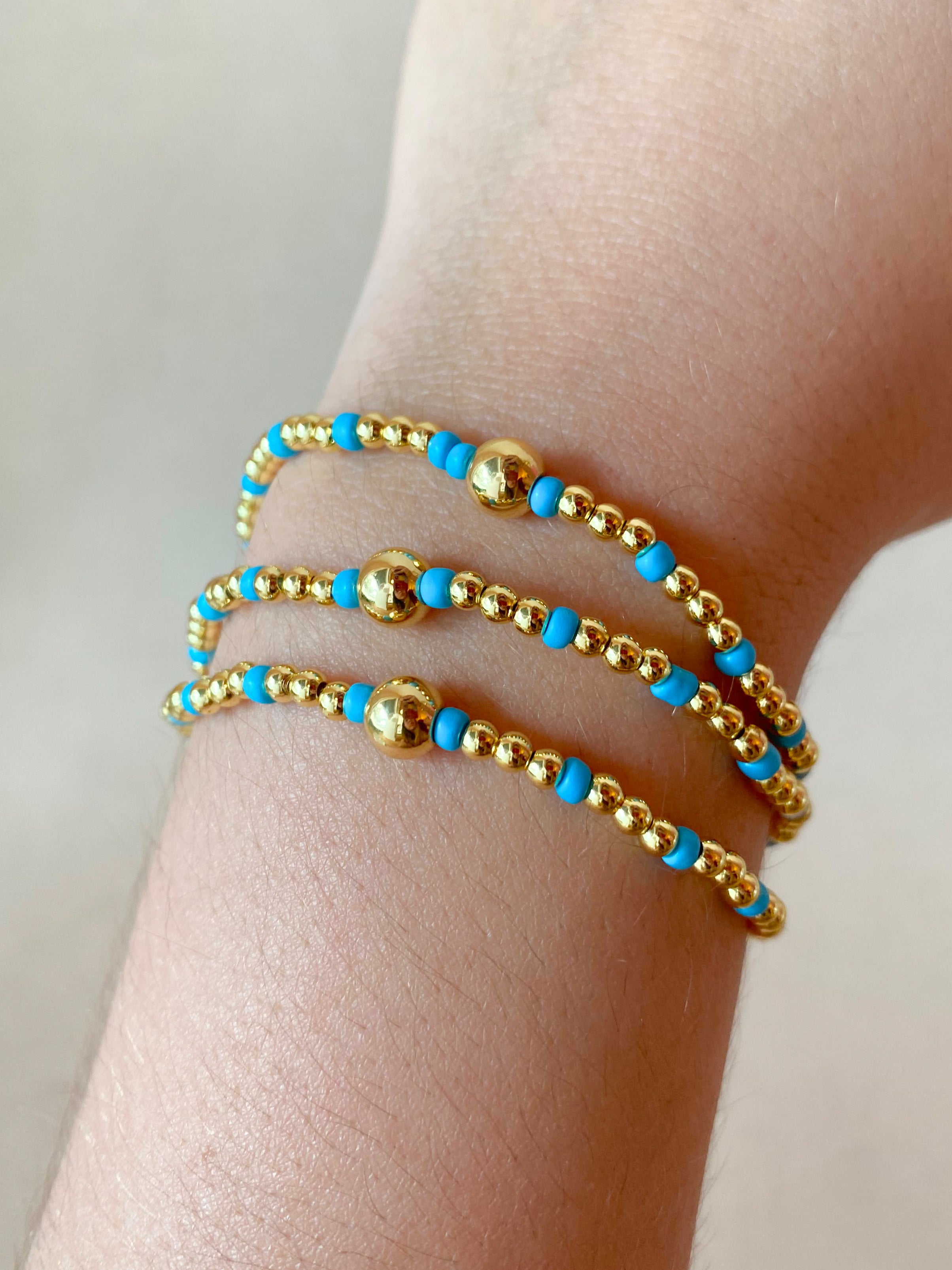 Set of 3 Elastic Golden and Blue Bracelets