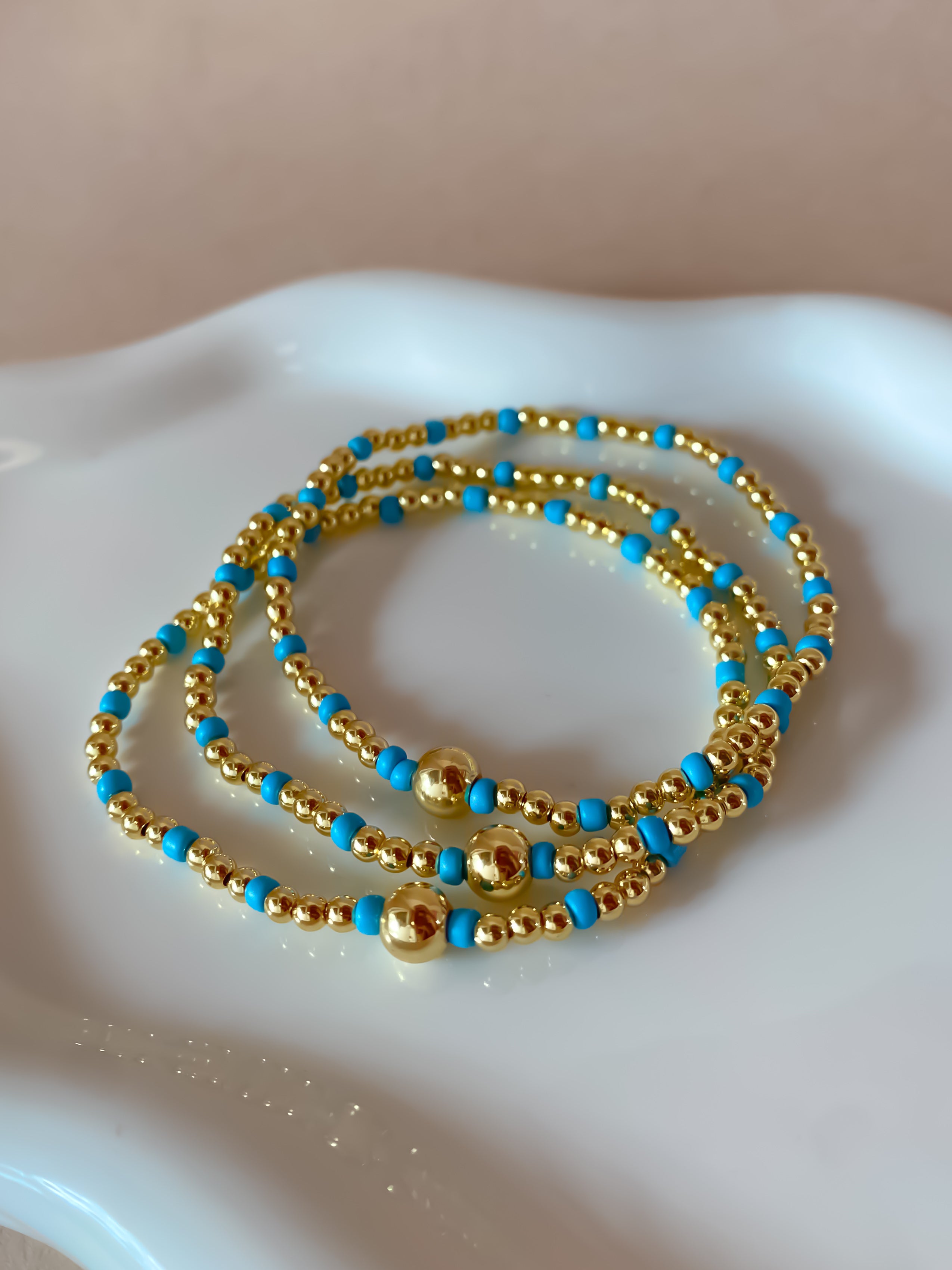 Set of 3 Elastic Golden and Blue Bracelets