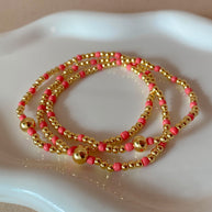 Set of 3 Elastic Golden and Pink Beads Bracelets