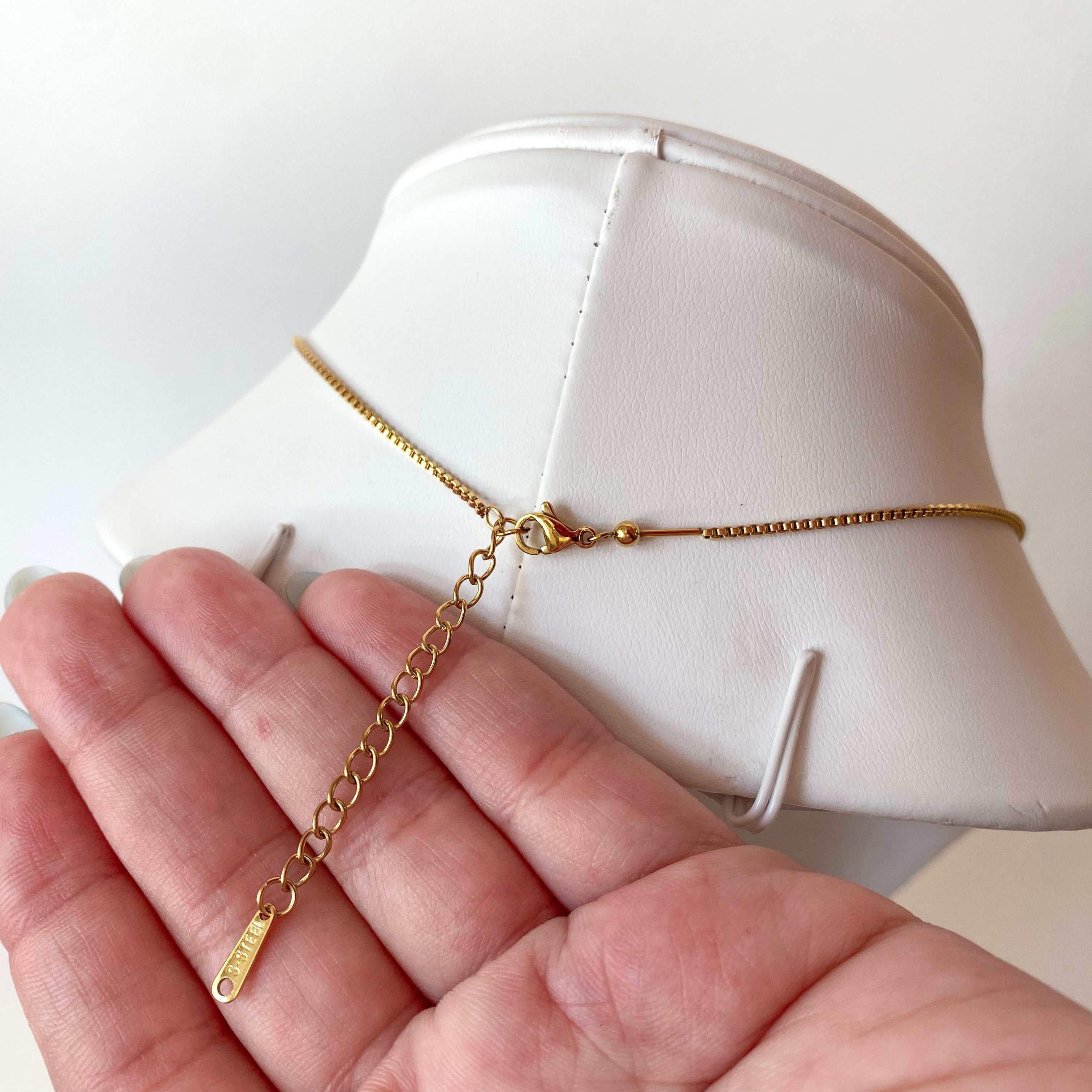 Faith Golden Steel Move Necklace
