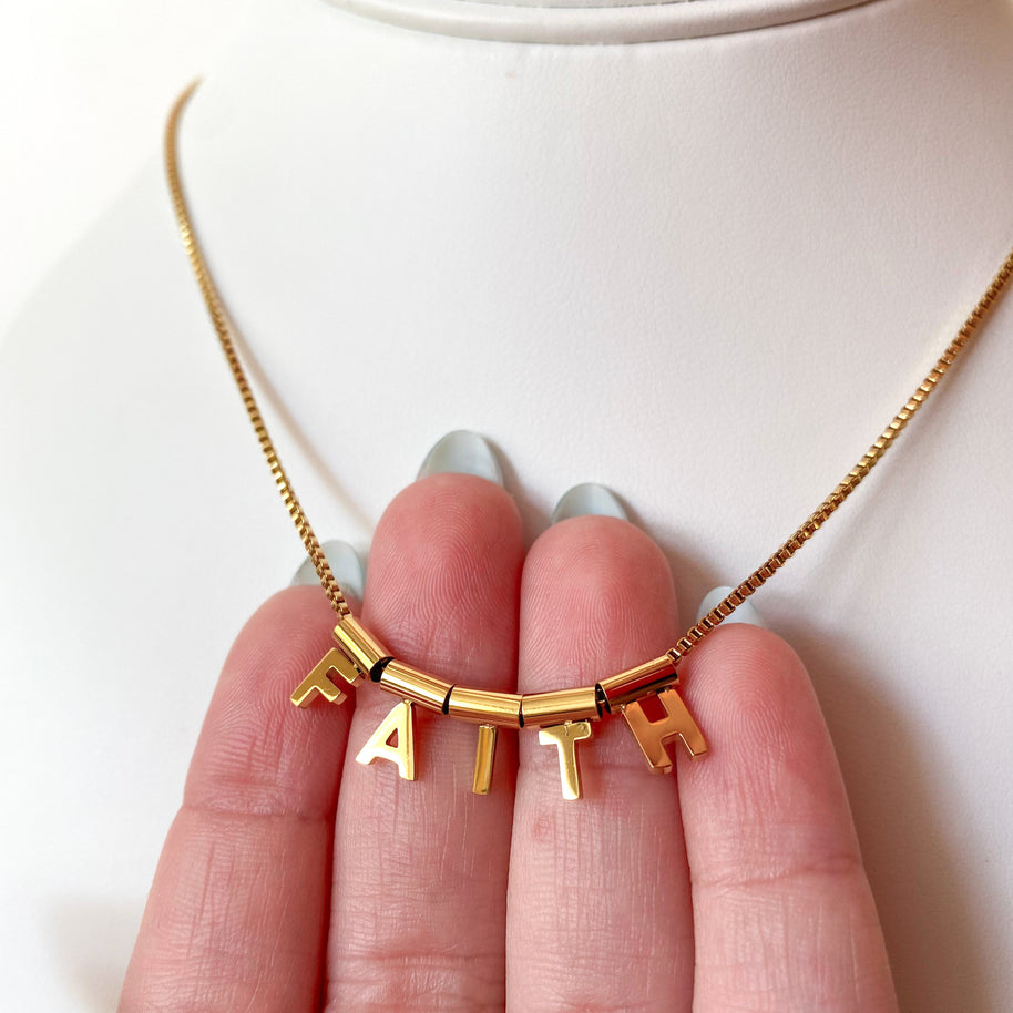 Faith Golden Steel Move Necklace