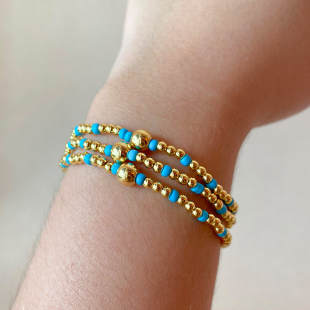 Set of 3 Elastic Golden and Blue Bracelets
