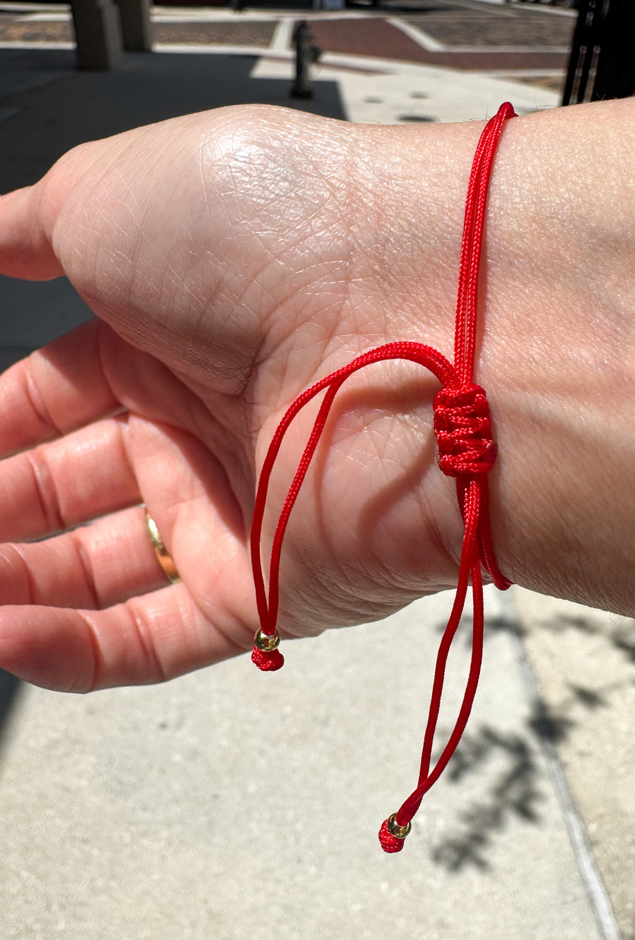 Red Azabache Bracelet with Hand Charm and Peony